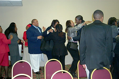 Guests entering seminar, greeted by TAG TEAM members, Los Angeles, California Black Business Seminar