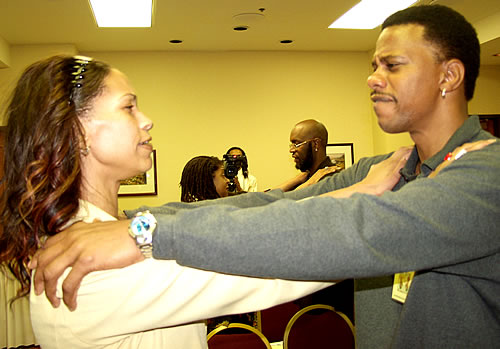 Sister and brother participating in exercise, Los Angeles, California Black Business Seminar