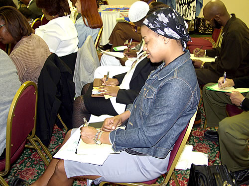 Sister taking notes, Los Angeles, California Black Business Seminar