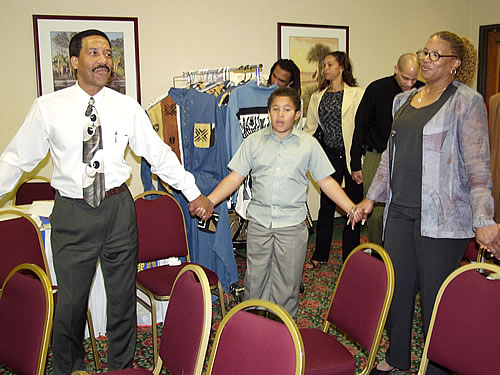 Audience holding hands, Los Angeles, California Black Business Seminar
