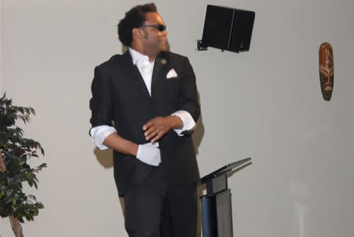 Erroll performing as Michael Jackson, singing 