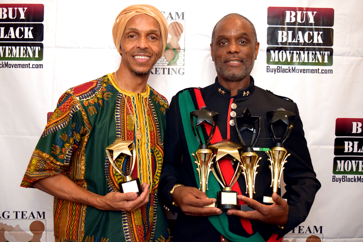 Chezyown and Nathaniel displaying their trophies, 2019 TAG Awards - Los Angeles, California