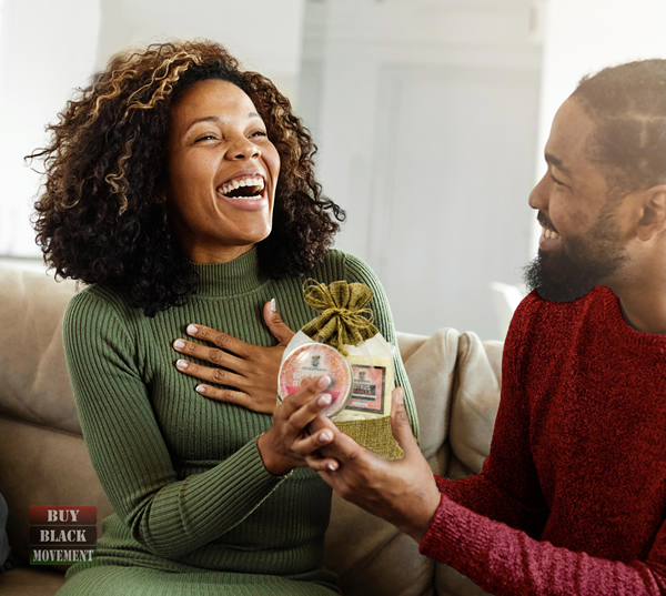 Black Woman receiving Aromastories Body Care Gift Set